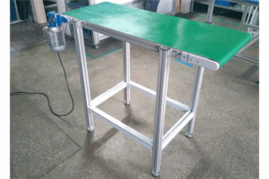 Miniature conveyor with flat belt