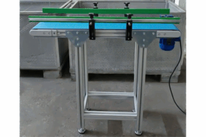 Miniature conveyor with flat belt